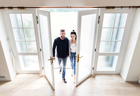 Image of two persons entering house